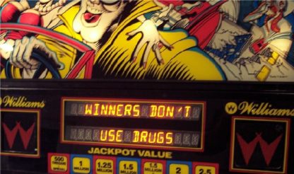 A close up of a sign with the words " winners don 't use drugs ".