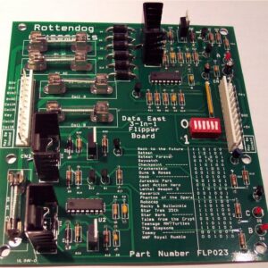 A green board with many different electronic components.