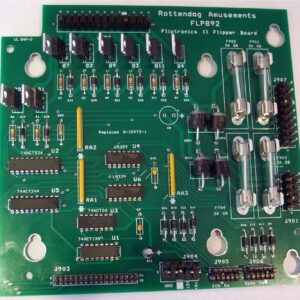 A green board with many different types of electronic components.