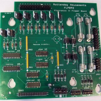 A green board with many different types of electronic components.