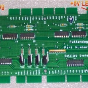 A green circuit board with many different types of electronic components.