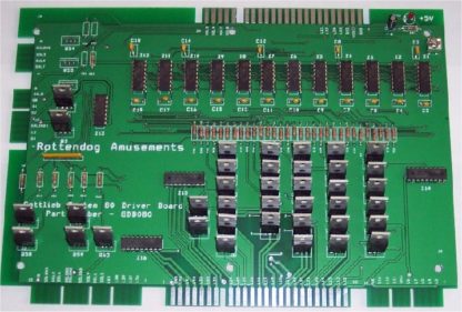A green board with many different types of electronic components.