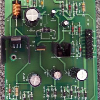 A green circuit board with many electronic components.
