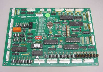 A green computer board with many different wires.