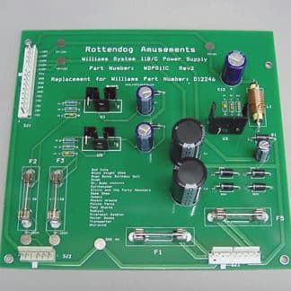 A green board with many different electronic components.