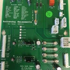A green board with many different electronic components.