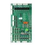 A green board with many wires and buttons
